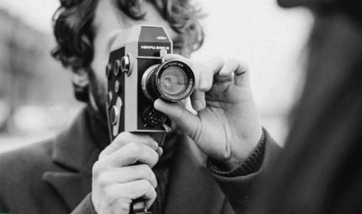 a man holding a video camera