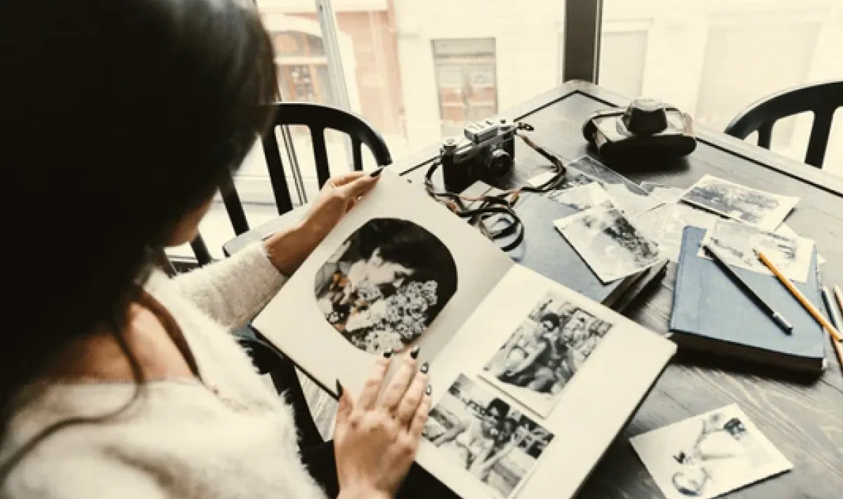 a girl reading a photo album